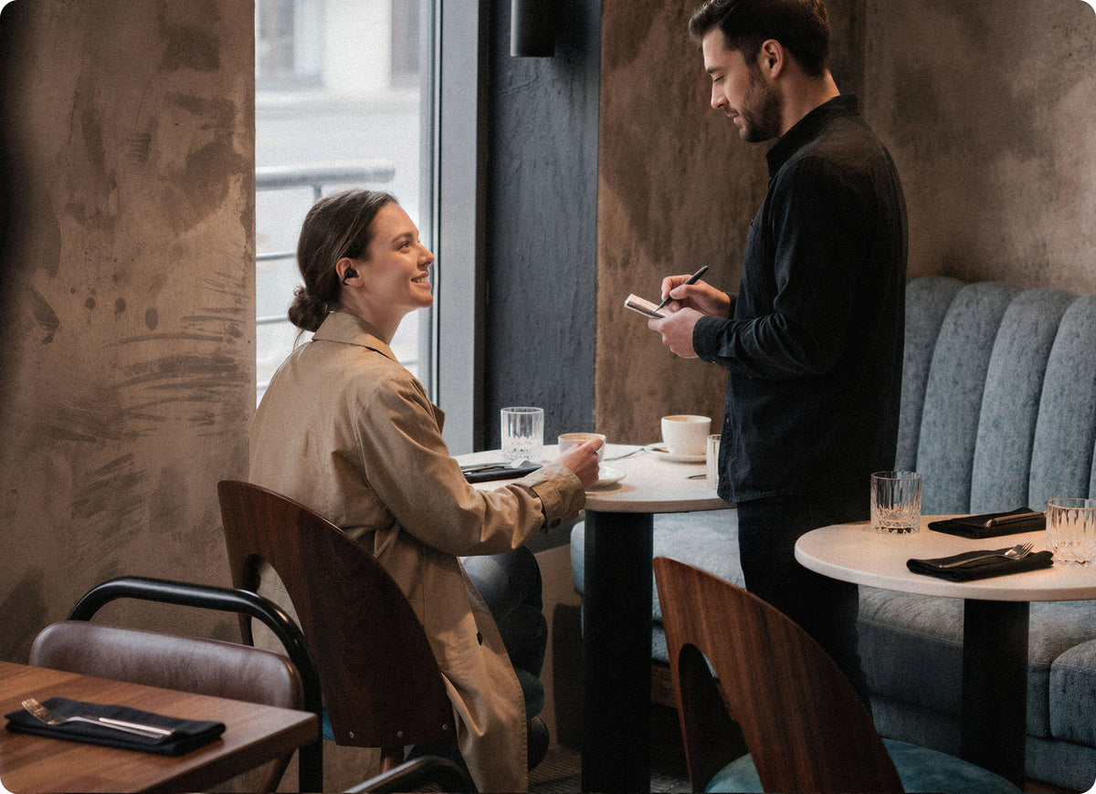 Woman talking with a friend in a coffee shop